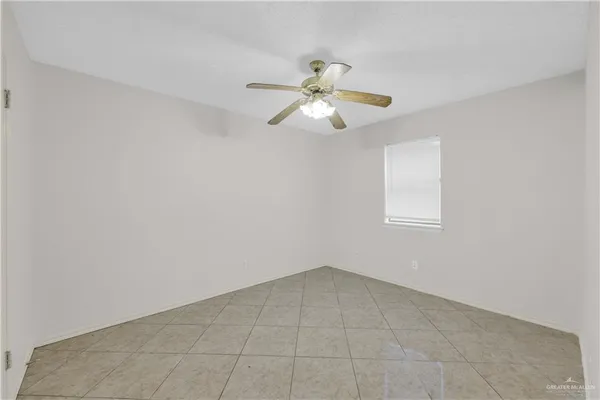 a view of a room with a ceiling fan and a chandelier fan