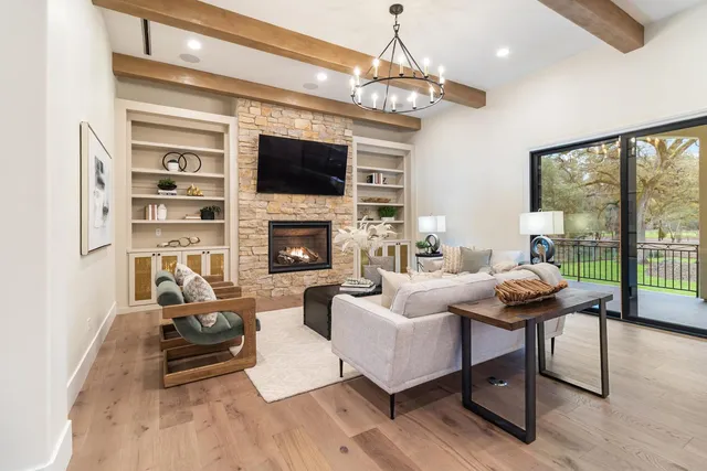 a large kitchen with kitchen island a table and chairs