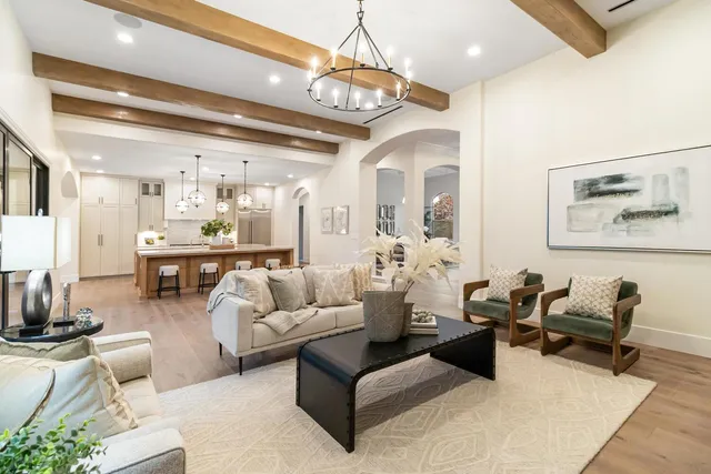 a kitchen with stainless steel appliances a sink stove and cabinets