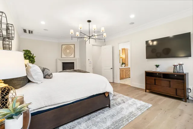 a living room with furniture a wooden floor and a table