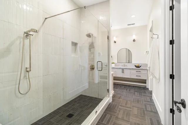 a view of a house with a big yard and large trees