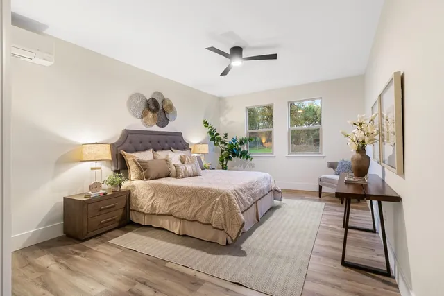 a bathroom with a sink tub and a mirror