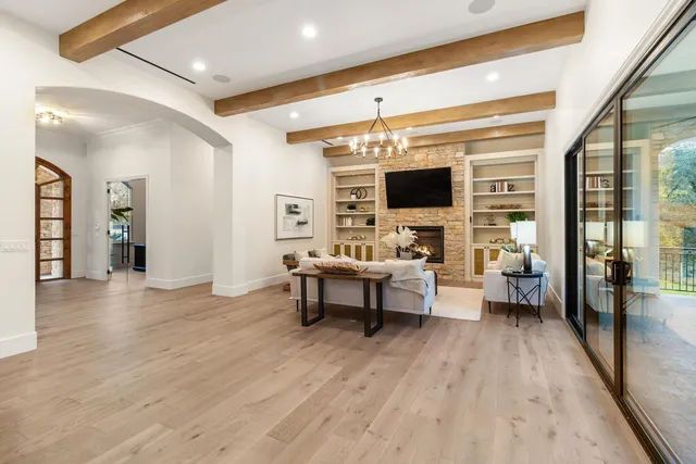 a large kitchen with a table and chairs