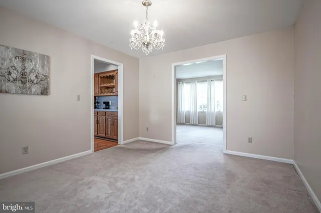 a view of a chandelier and window in a room