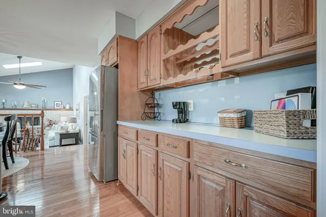 a kitchen with stainless steel appliances granite countertop a sink and cabinets