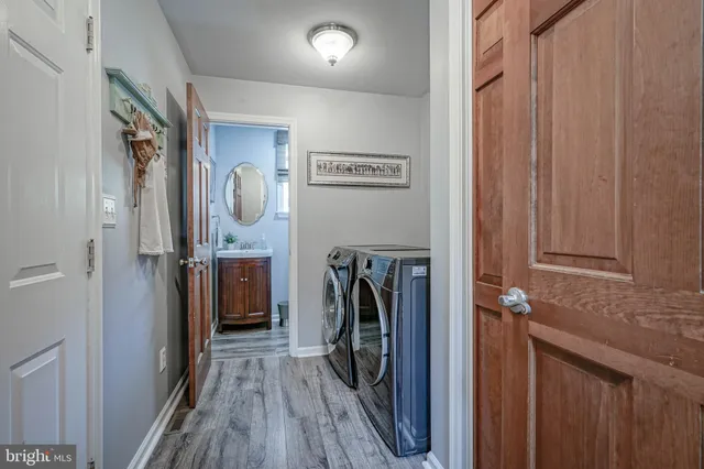 a view of a hallway with a washer and dryer