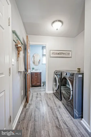 a view of a hallway with washer and dryer