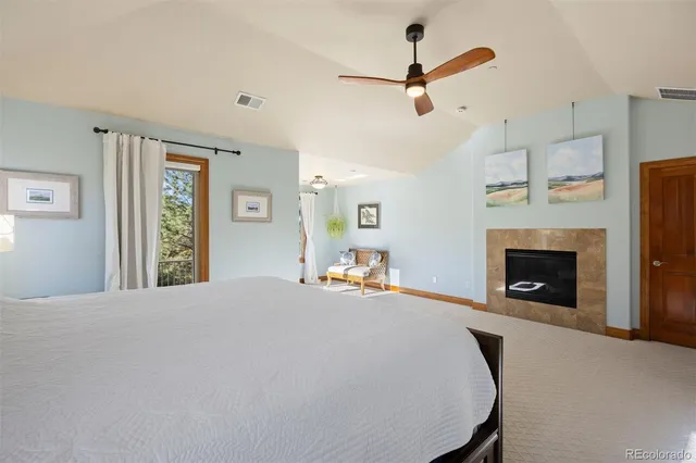 a bed room with a bed and a fireplace