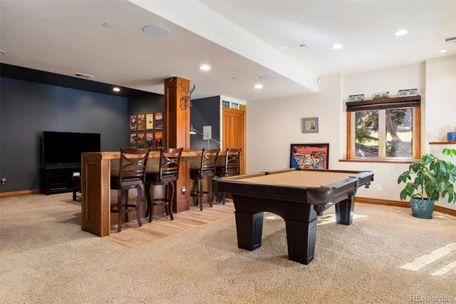 a large kitchen with lots of table and chairs