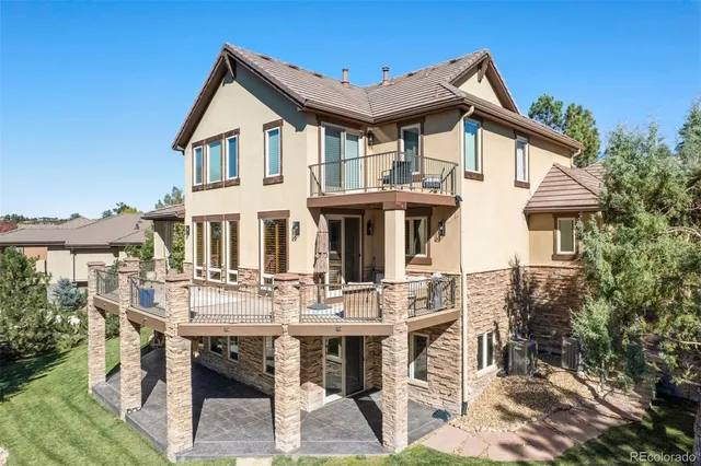 a view of house with a dining table and chairs
