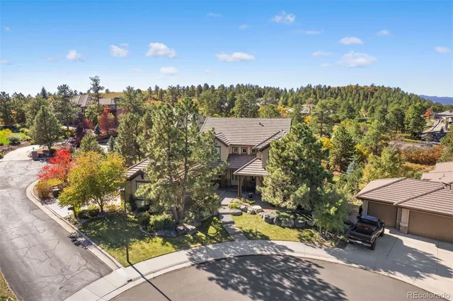 a living room with furniture or wooden floor and a large window