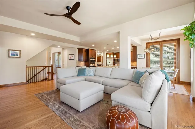 a living room with furniture or kitchen view and a wooden floor