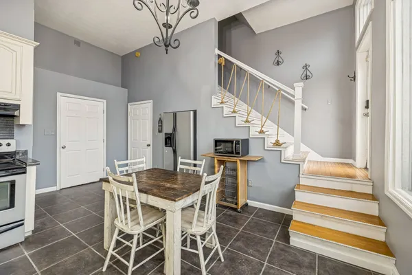 a view of entryway and hall with dining room