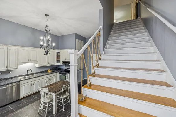 a kitchen with granite countertop lots of counter top space and stainless steel appliances