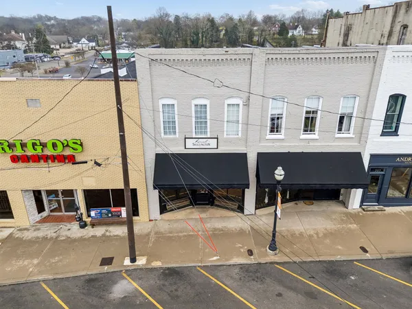 a view of a patio with a table and chairs