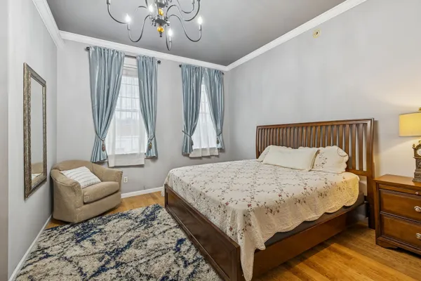 a bedroom with a bed and a couch