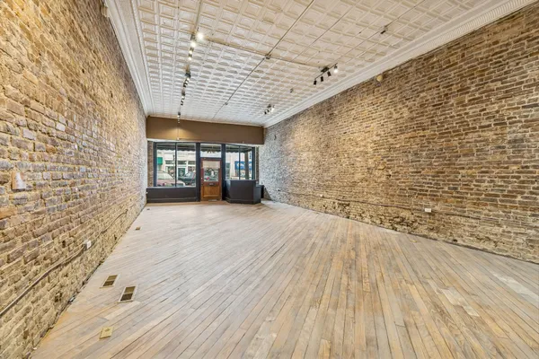a view of entryway with wooden floor