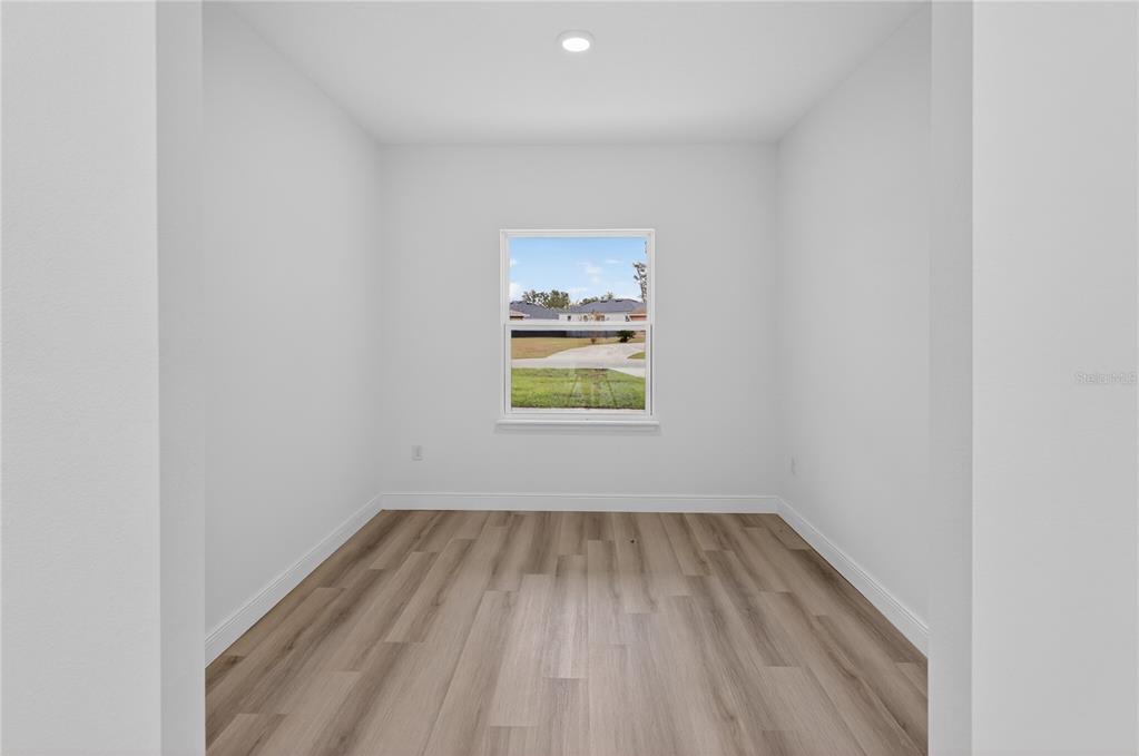 15028 Southwest 25th Circle Ocala, FL 34473 - Photo 19 of 35 a view of room with window and hardwood floor
