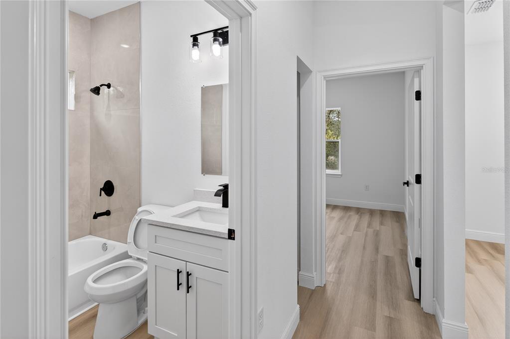 15028 Southwest 25th Circle Ocala, FL 34473 - Photo 31 of 35 a bathroom with a sink toilet and shower