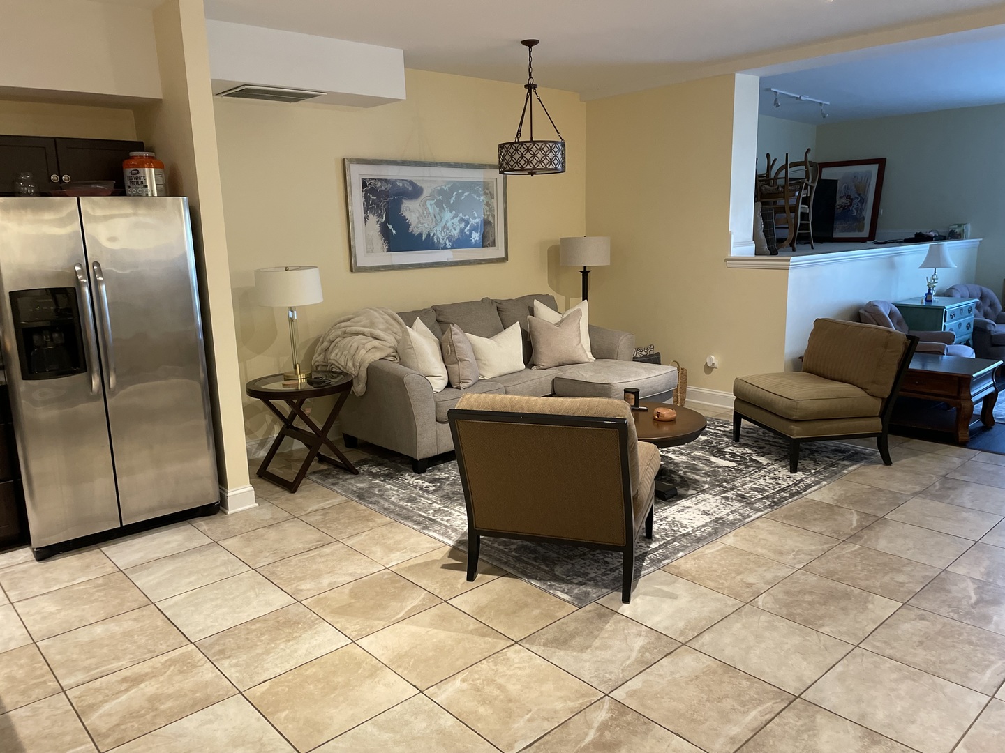 2801 West Ardmore Avenue, Unit 1A Chicago, IL 60659 - Photo 11 of 12 a living room with furniture and a flat screen tv
