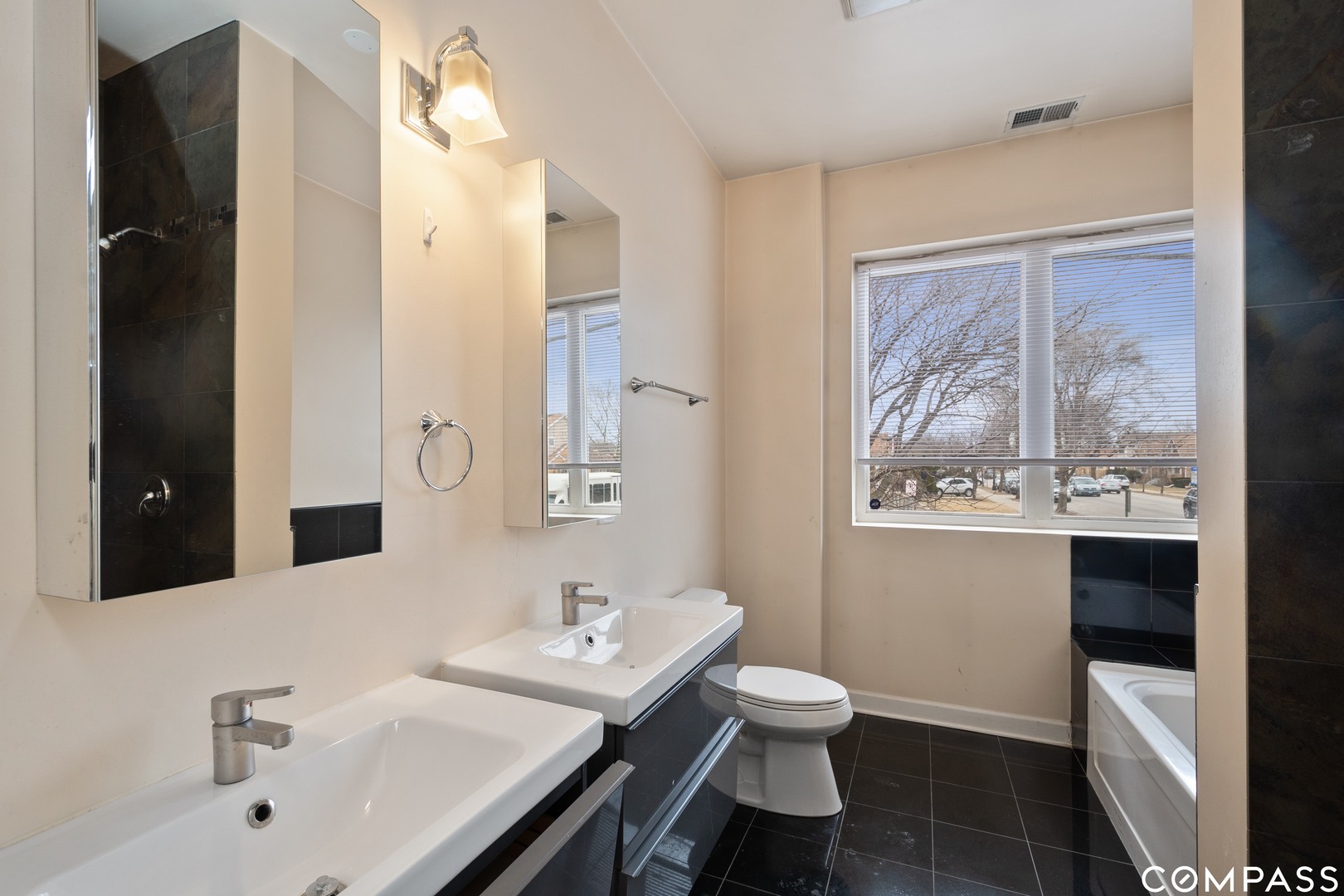 2801 West Ardmore Avenue, Unit 1A Chicago, IL 60659 - Photo 4 of 12 a bathroom with a sink toilet and shower