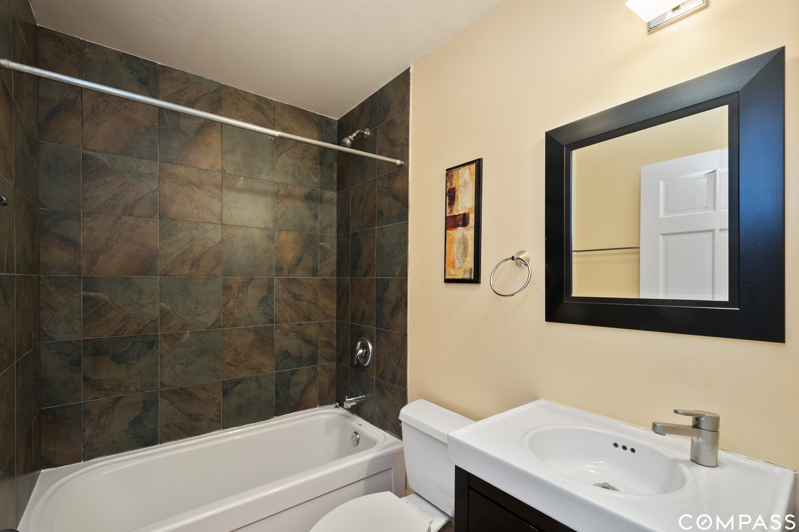 2801 West Ardmore Avenue, Unit 1A Chicago, IL 60659 - Photo 5 of 12 a bathroom with a sink and a bathtub