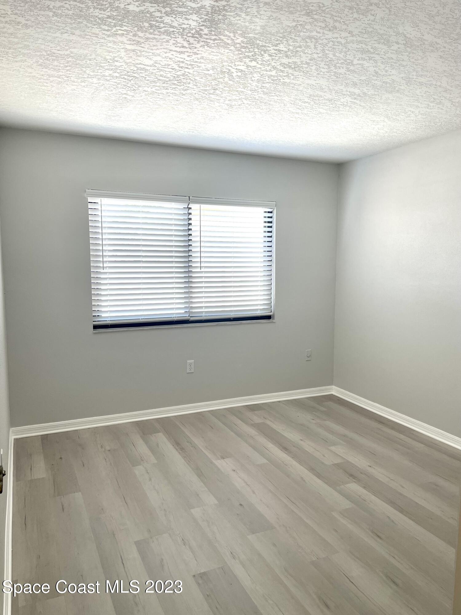 179 Shell Place, Unit 36 Rockledge, FL 32955 - Photo 14 of 20 a view of an empty room with a window
