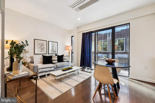 a workspace with furniture and a potted plant