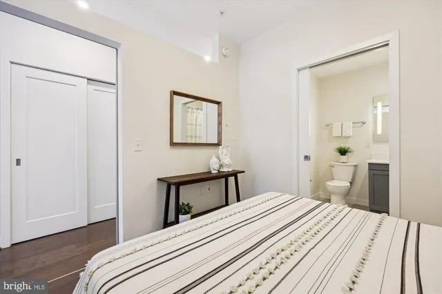 a bedroom with a bed and a table