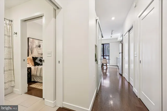 a view of hallway with wooden floor