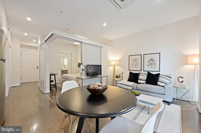 a living room with furniture and a table