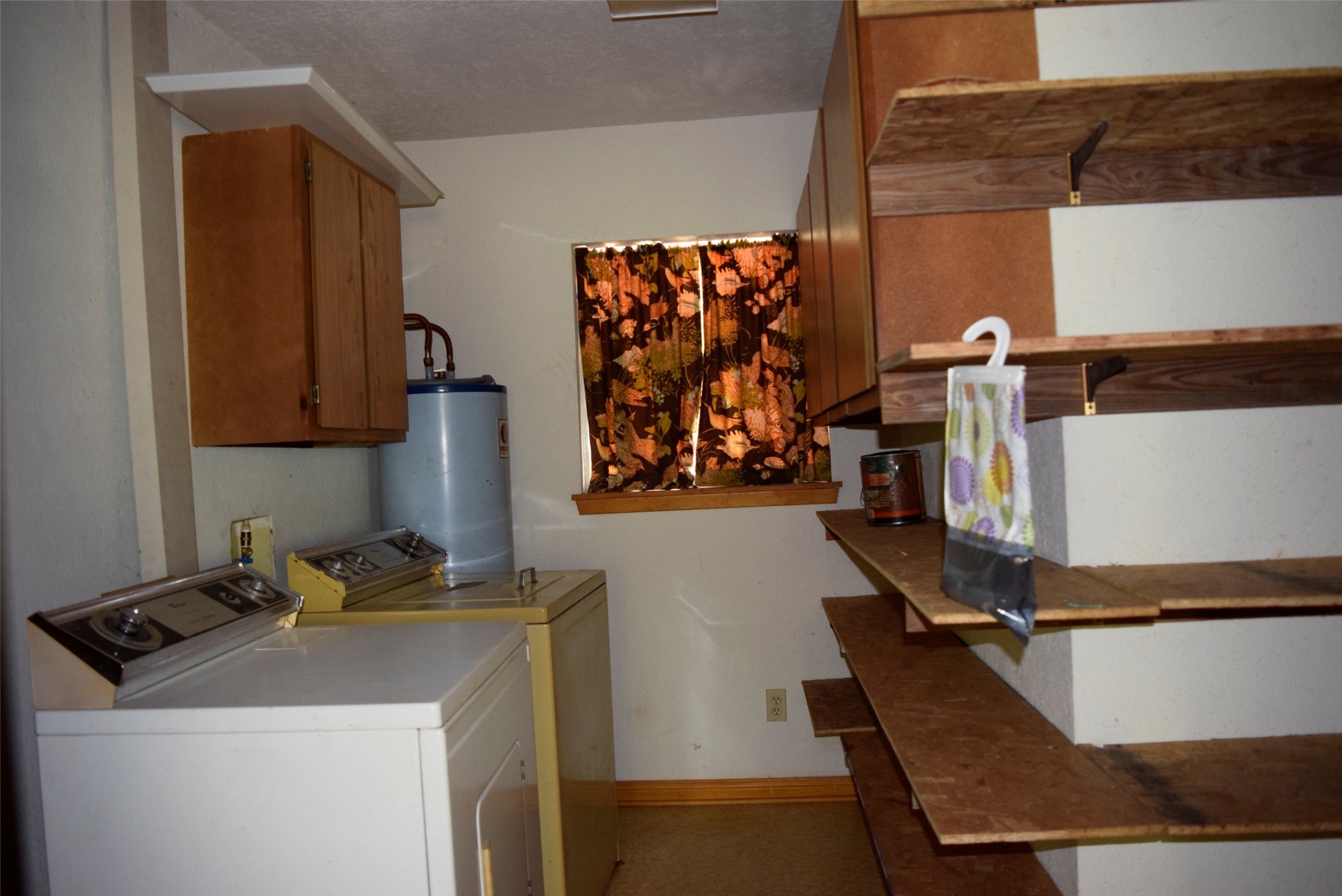 732 River Road Goodrich, TX 77335 - Photo 19 of 20 a room with storage and utility