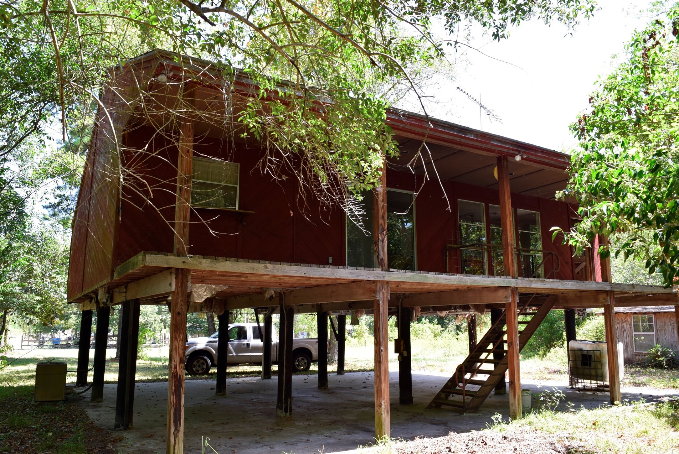732 River Road Goodrich, TX 77335 - Photo 6 of 20 a view of a chairs and table in the patio