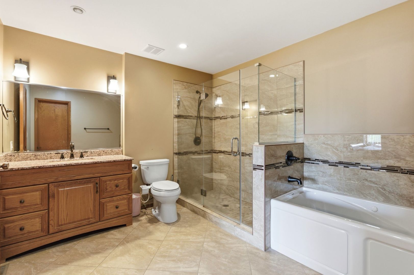 1735 Larson Lane Roselle, IL 60172 - Photo 16 of 35 a bathroom with a granite countertop sink mirror and shower