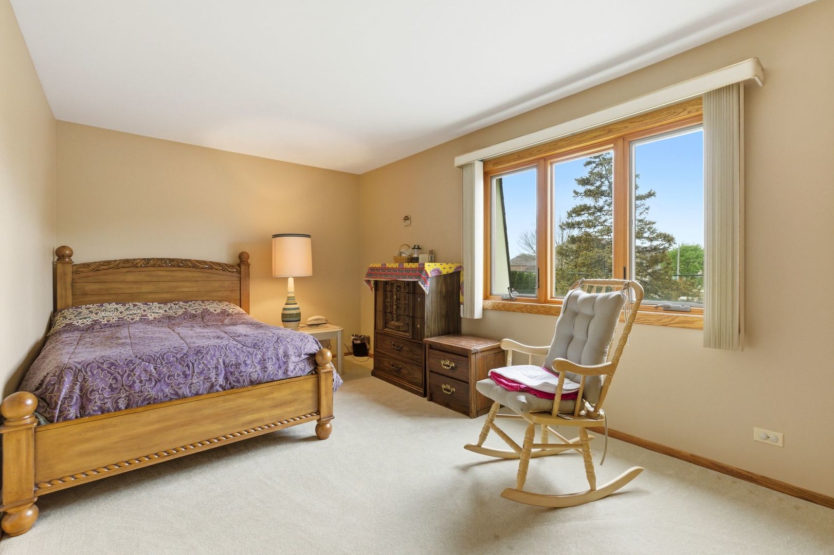 1735 Larson Lane Roselle, IL 60172 - Photo 17 of 35 a bedroom with a bed chair and a window