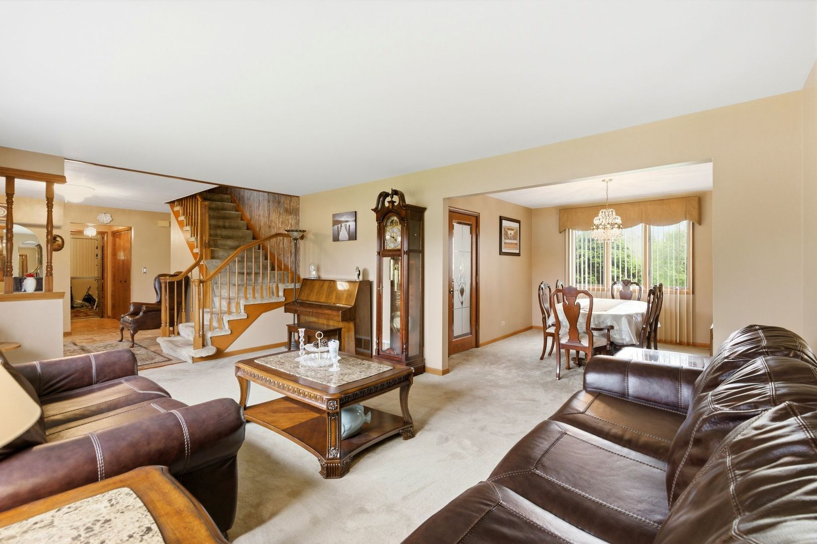 1735 Larson Lane Roselle, IL 60172 - Photo 8 of 35 a living room with furniture and a large window