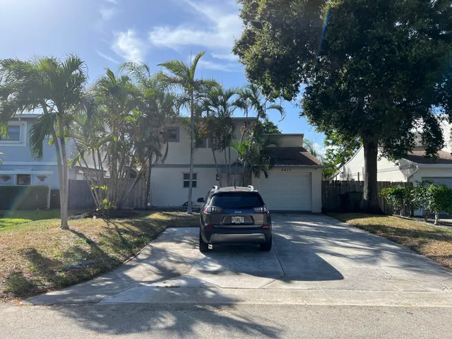 a car parked in front of a house