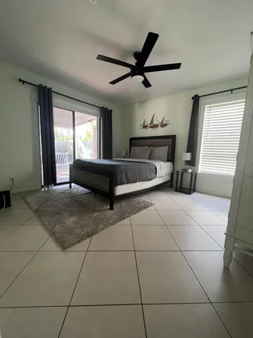 a living room with a couch and a rug