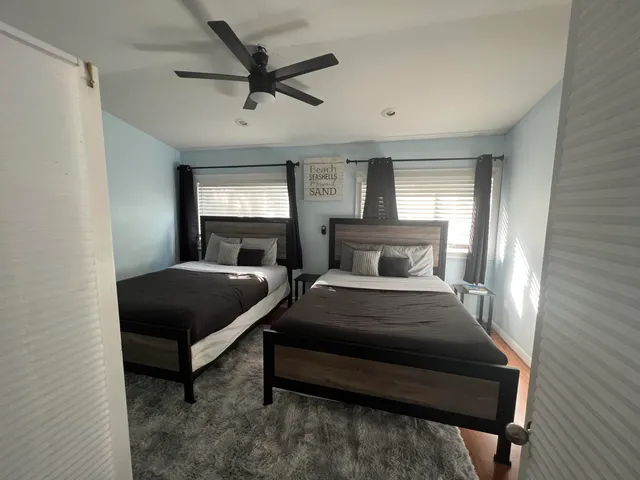 a bedroom with a bed and window