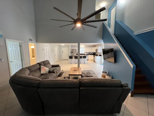 a living room with furniture and white walls