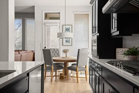 a view of a dining room with furniture and wooden floor
