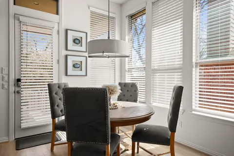 a dining room with furniture and window