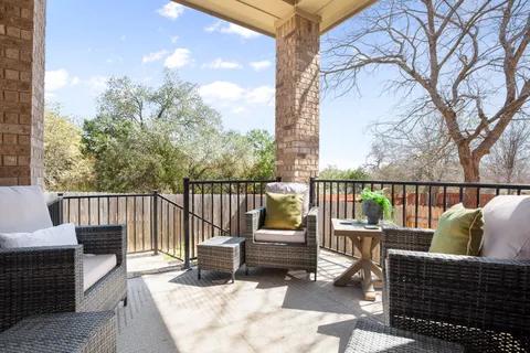a view of balcony with furniture