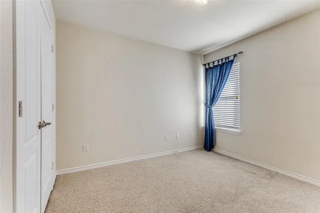 a view of a livingroom with washer and dryer