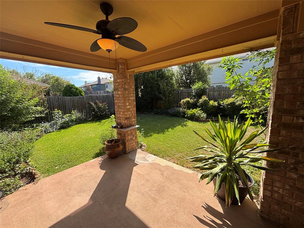 3516 Desert Mesa Road Fort Worth, TX 76262 - Photo 14 of 16 Covered patio with ceiling fan