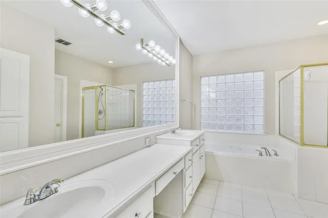 a bathroom with a bathtub and a sink