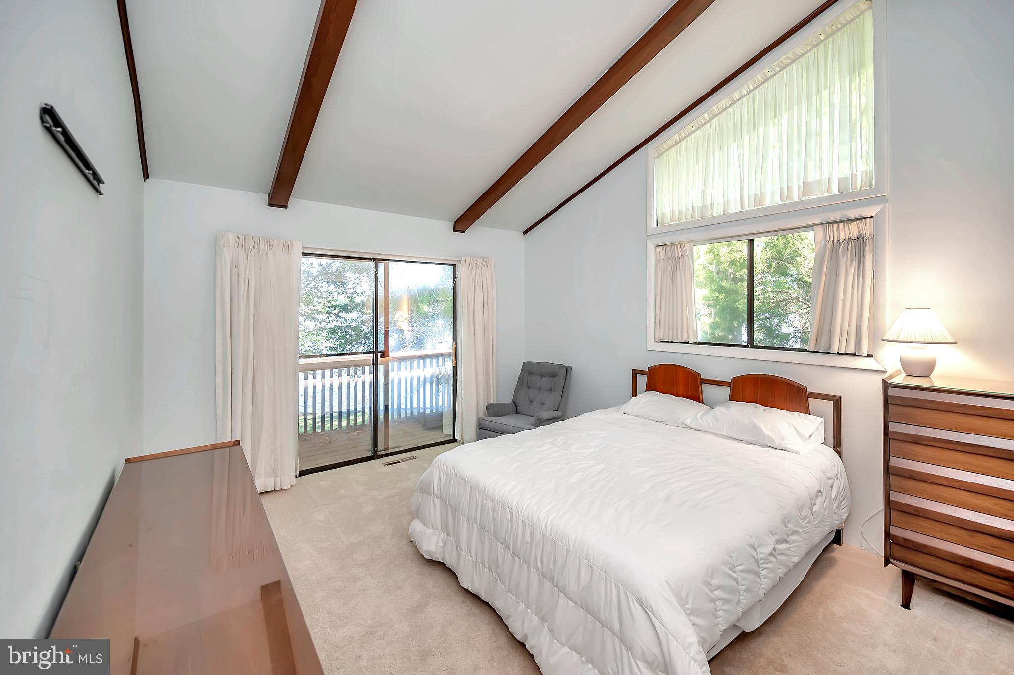 129 Greenspring Road Locust Grove, VA 22508 - Photo 15 of 27 Owner's suite with water views of the lake