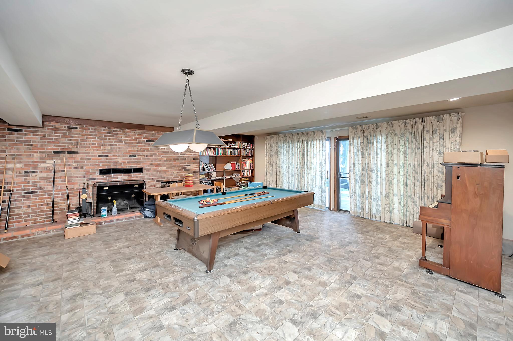 129 Greenspring Road Locust Grove, VA 22508 - Photo 22 of 27 Lower level family room with expansive fireplace