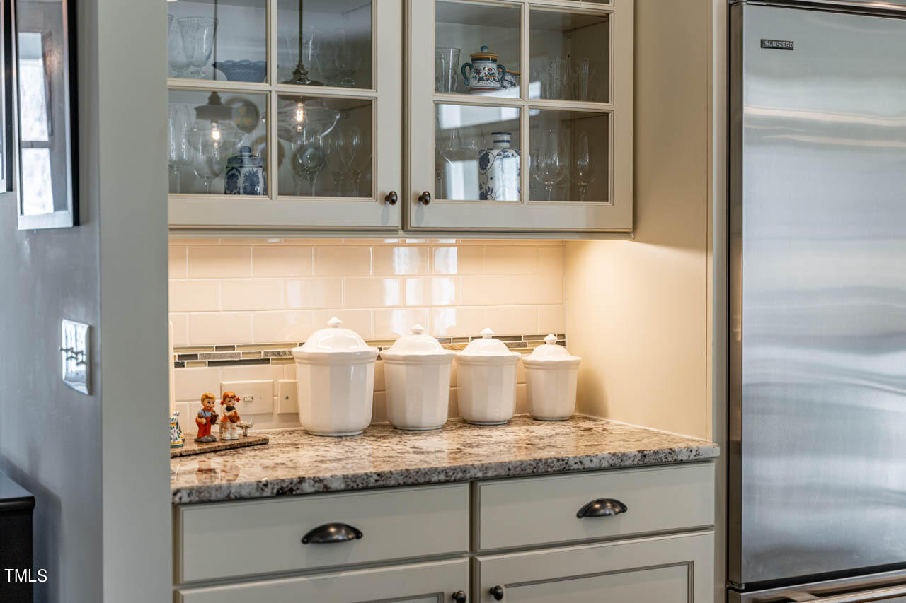 499 Bennett Mountain Trace Chapel Hill, NC 27516 - Photo 18 of 75 a bathroom with a granite countertop sink and a window