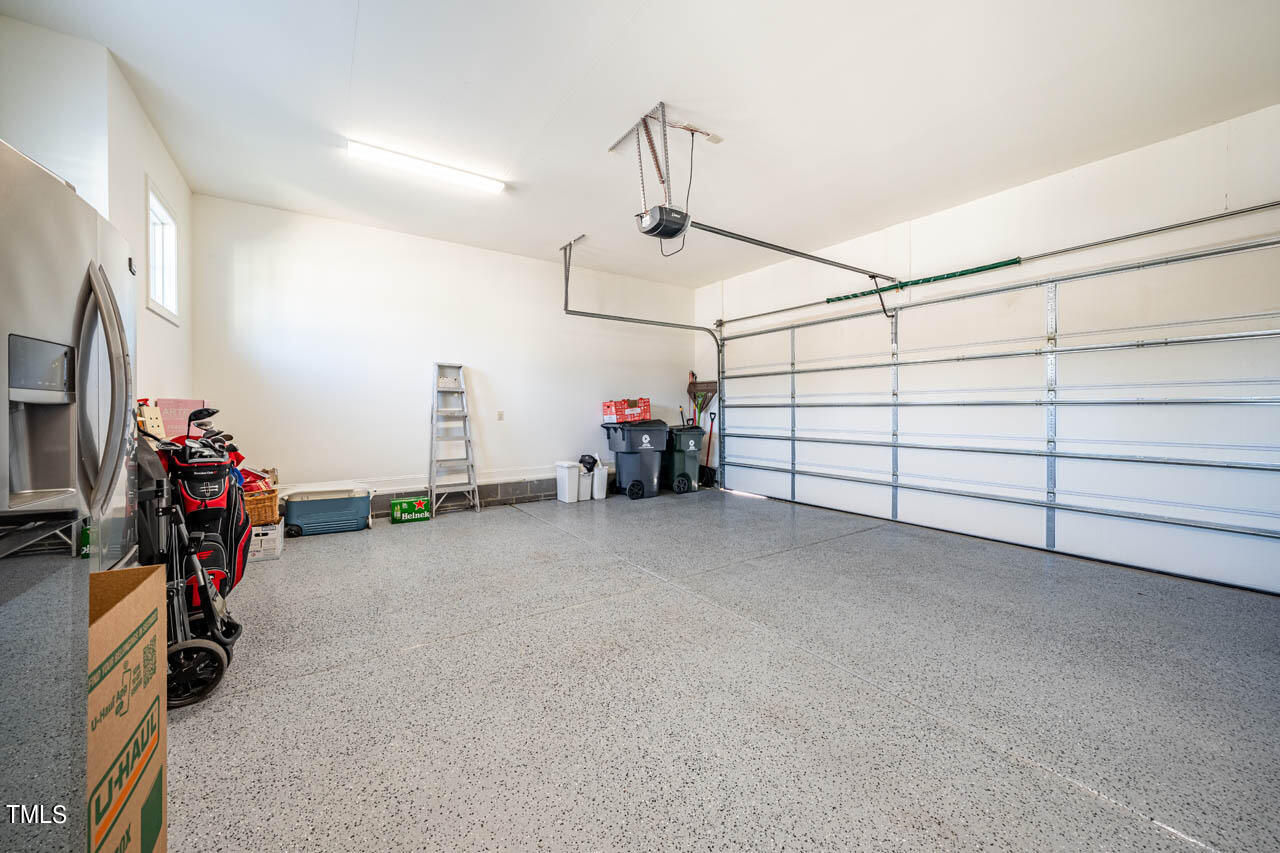499 Bennett Mountain Trace Chapel Hill, NC 27516 - Photo 26 of 75 a view of a garage with rack and bicycle